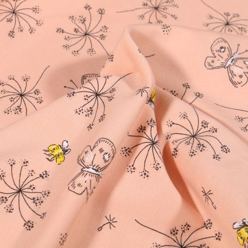 Tissu Jersey Coton Pissenlit et papillons sur fond Rose saumon