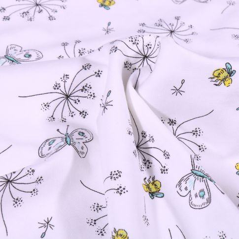 Tissu Jersey Coton Pissenlit et papillons sur fond Blanc