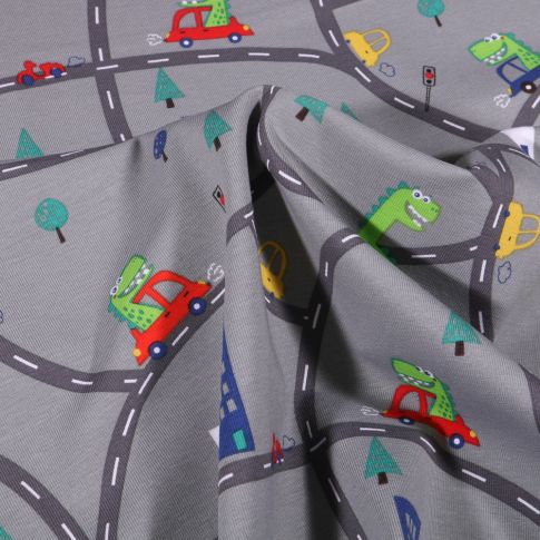 Tissu Jersey Coton Dinosaures en ville sur fond Gris