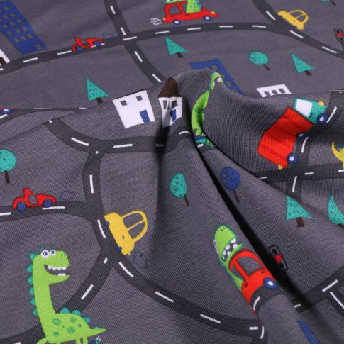 Tissu Jersey Coton Dinosaures en ville sur fond Gris anthracite