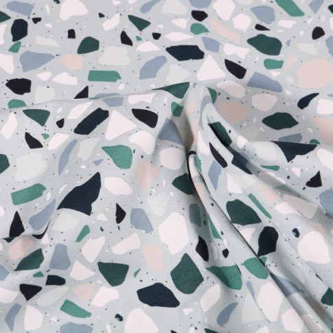 Tissu Jersey Coton Terrazzo gris vert sur fond Vert pâle