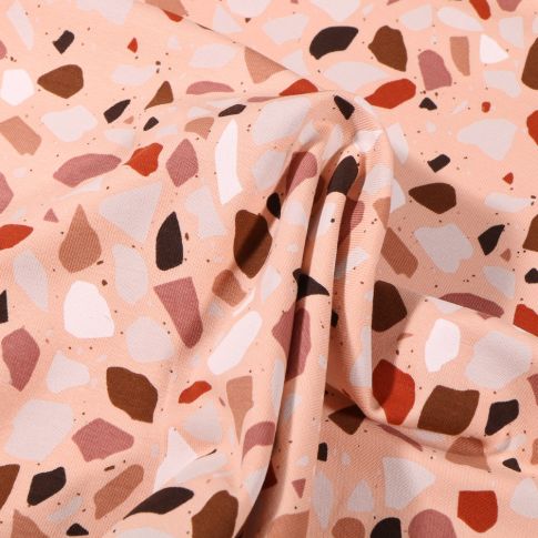 Tissu Jersey Coton Terrazzo blanc rouille sur fond Rose saumon