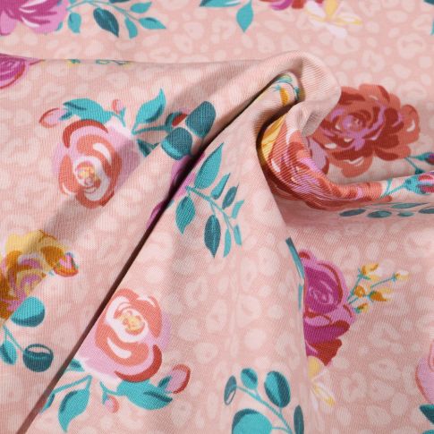 Tissu Jersey Coton Tâches léopard et fleurs colorées sur fond Rose pâle