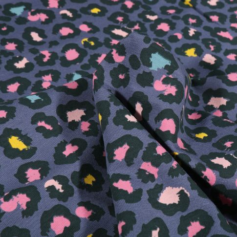 Tissu Jersey Coton Tâches léopard multicolores sur fond Bleu gris