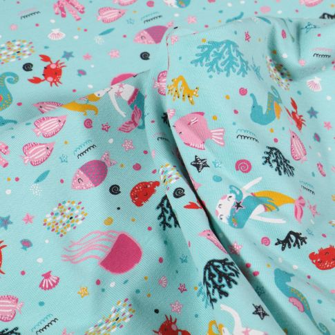 Tissu Jersey Coton Sirènes sous l'océan sur fond Bleu lagon