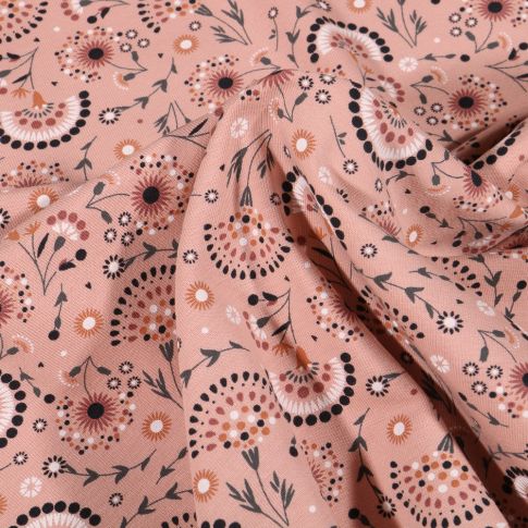 Tissu Jersey Coton Pissenlit stylisé sur fond Rose saumon