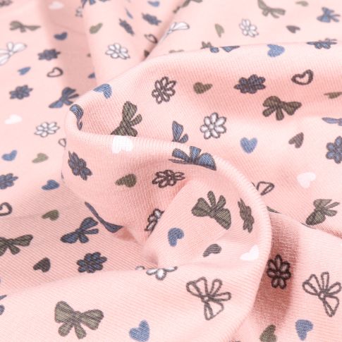 Tissu Jersey Coton Petits nœuds et cœurs sur fond Rose pâle