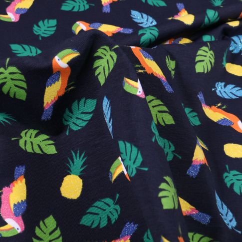 Tissu Jersey Coton Toucans pailletés, ananas et feuilles tropicales sur fond Bleu marine