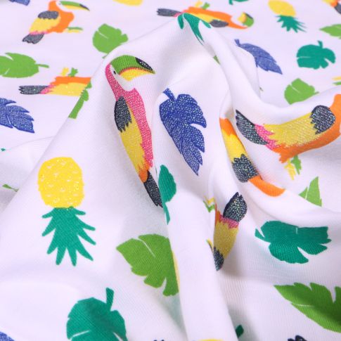 Tissu Jersey Coton Toucans pailletés, ananas et feuilles tropicales sur fond Blanc