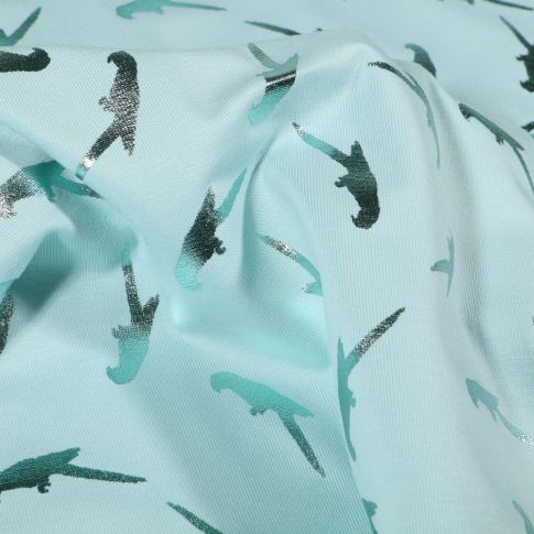 Tissu Jersey Coton Perroquets métallisés sur fond Bleu lagon