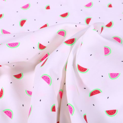 Tissu Jersey Coton Petits confettis noir et pastèques fluo sur fond Blanc