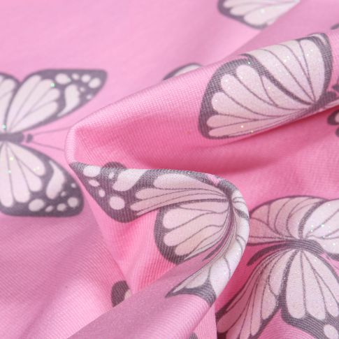 Tissu Jersey Coton Papillons et cœurs pailletés sur fond Rose