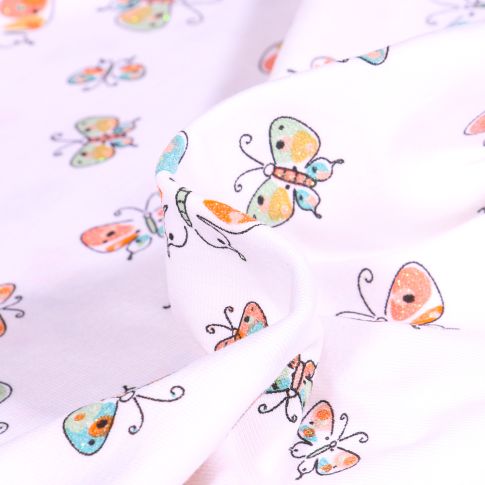 Tissu Jersey coton Papillon pailleté sur fond Blanc