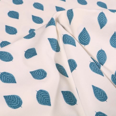 Tissu Jersey Coton Feuilles bleues sur fond Blanc cassé