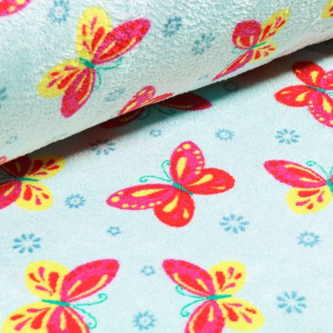 Tissu Doudou Papillons roses sur fond Bleu