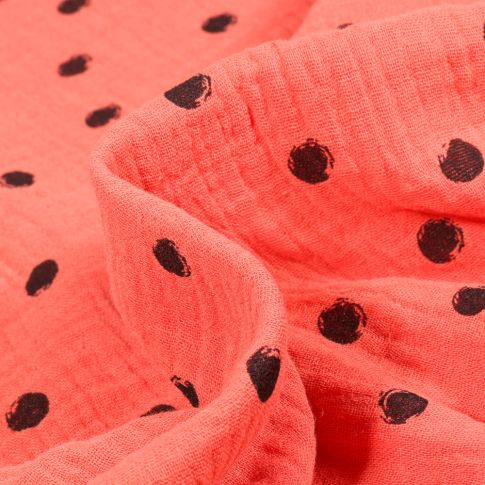 Tissu Double gaze Pois noirs sur fond Corail