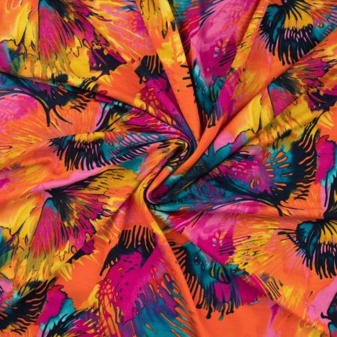Tissu Jersey Viscose imprimé Feuilles multicolores sur fond Orange