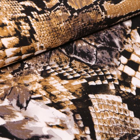 Tissu Viscose Twill Reptiles colorés ocre sur fond Noir