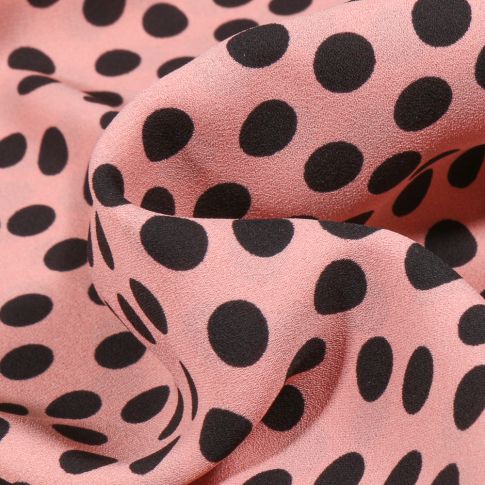 Tissu Crêpe Georgette Pois noirs sur fond Rose
