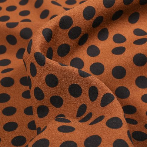 Tissu Crêpe Georgette Pois noirs sur fond Brique