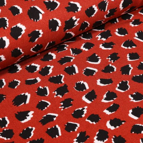 Tissu  Viscose Twill Tacheté noir sur fond Brique