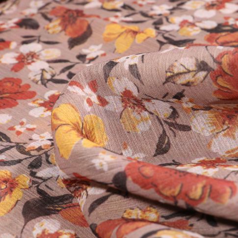 Tissu Mousseline Crépon Fleurs orange et jaune sur fond Beige