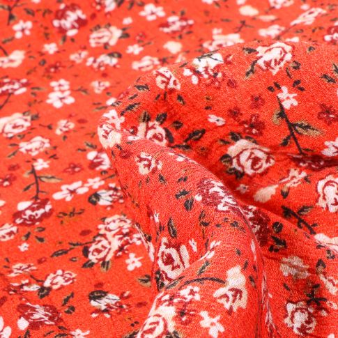 Tissu Viscose Rosie sur fond Rouge
