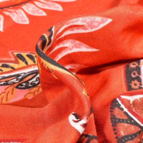 Tissu Jersey Viscose aspect maille Feuilles palmier sur fond Orange