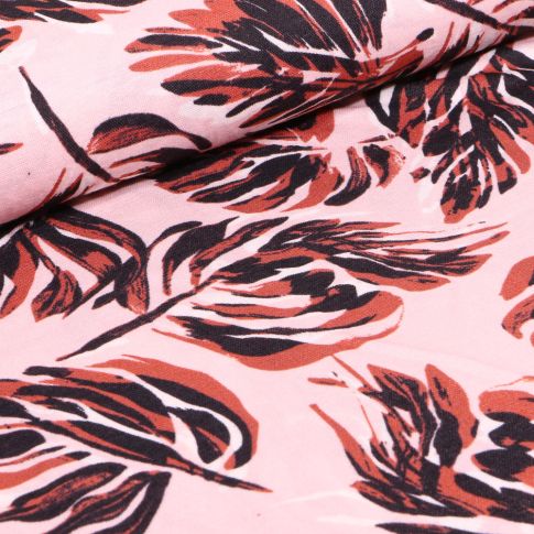 Tissu Jersey Viscose aspect maille Feuilles noires et marrons sur fond Rose pâle