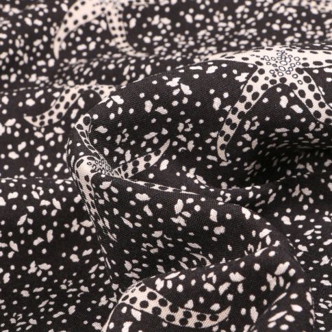 Tissu Viscose légère Etoile de mer Beige sur fond Noir