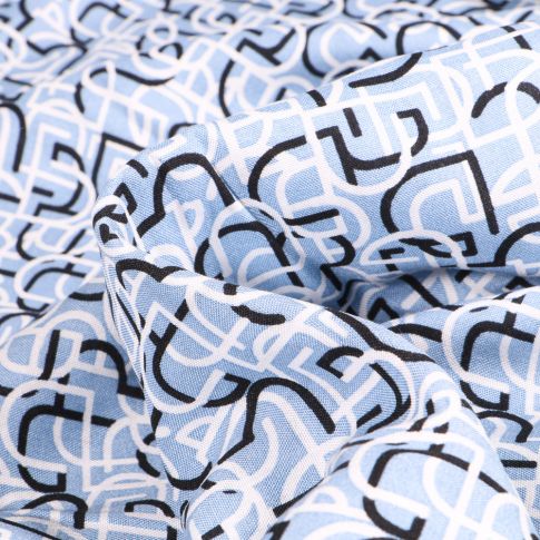 Tissu Viscose légère Lignes abstraites sur fond Bleu clair