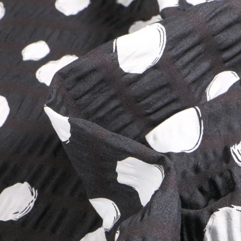 Tissu Seersucker Pois blanc destructuré sur fond Noir