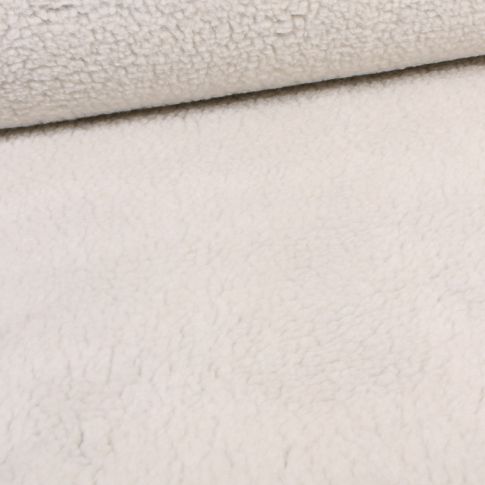 Tissu Fausse fourrure mouton envers maille ecru sur fond Gris chiné