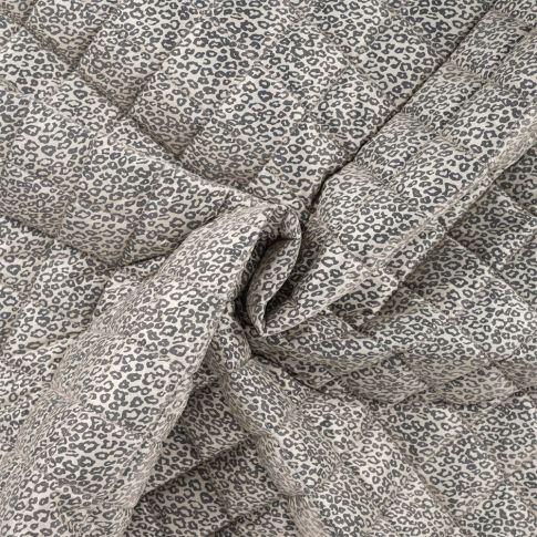 Tissu Matelassé doudoune réversible motif léopard sur fond Crème