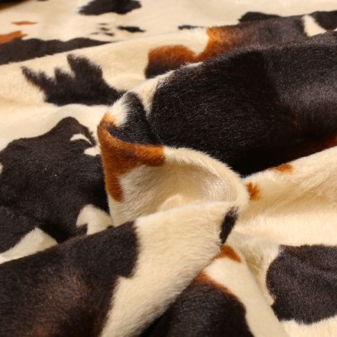 Tissu Velours Peau de bête Vache normande sur fond Beige