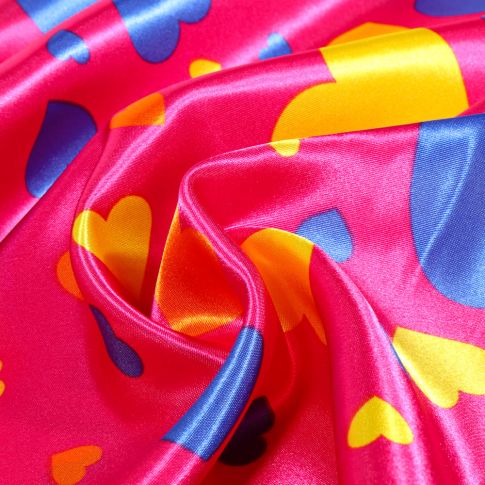 Tissu Satin Coeurs multicolores sur fond Rose