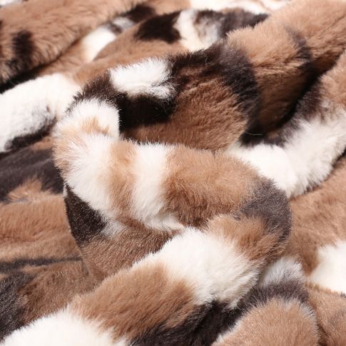 Tissu Fausse fourrure  Bovin sur fond Marron