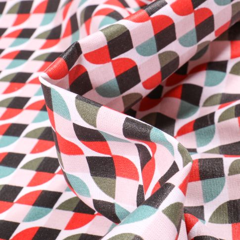 Tissu Coton enduit Seventies rouge et vert sur fond Blanc