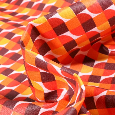 Tissu Coton enduit Seventies orange sur fond Blanc