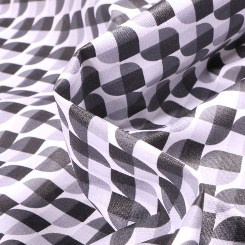 Tissu Coton enduit Seventies gris et noir sur fond Blanc
