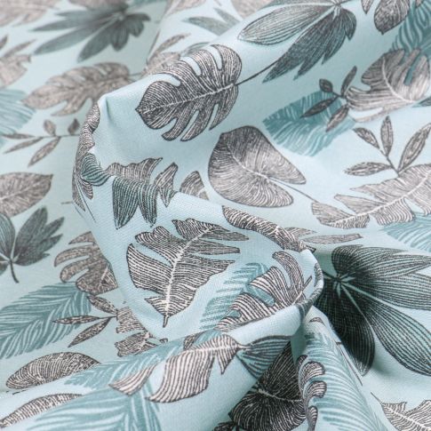 Tissu Coton enduit Sun leaves sur fond Bleu clair