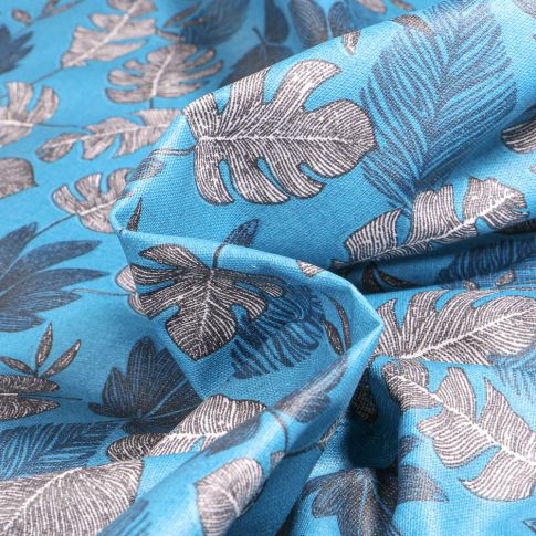 Tissu Coton enduit Sun leaves sur fond Bleu