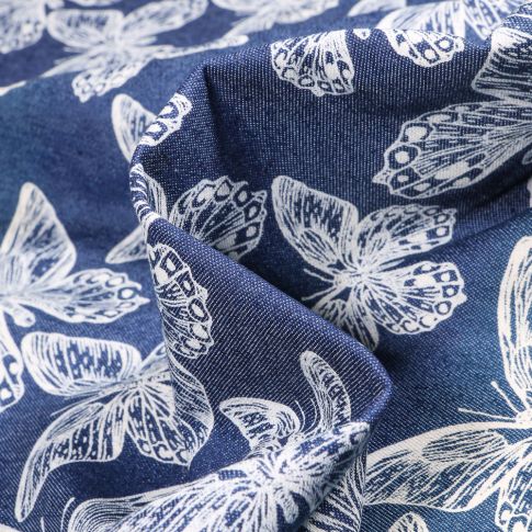 Tissu Jean Denim Papillons blancs sur fond Bleu foncé