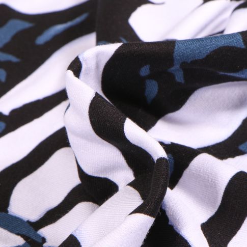Tissu Jersey Viscose Vortex Motifs abstraits blanc sur fond Noir