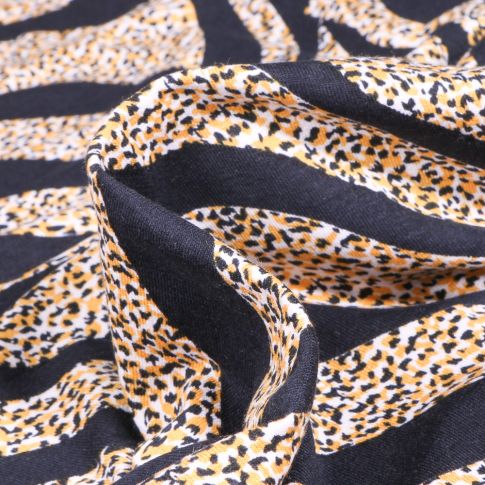 Tissu Jersey Viscose  Zébré et tâcheté sur fond Bleu marine