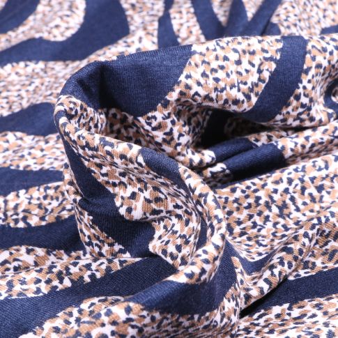 Tissu Jersey Viscose  Zébré et tâcheté sur fond Bleu