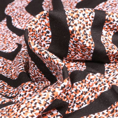 Tissu Jersey Viscose  Zébré et tâcheté sur fond Noir
