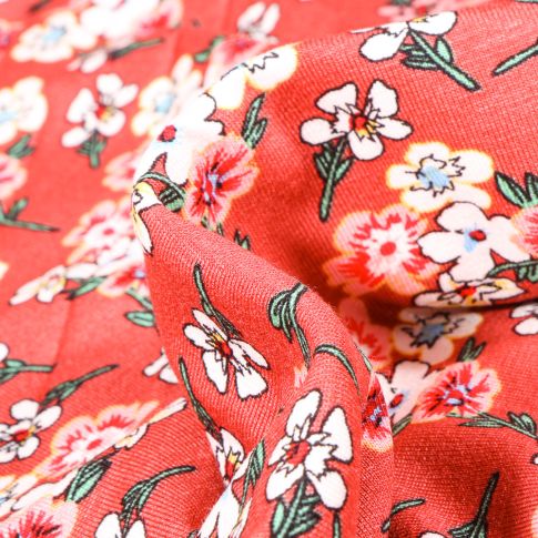 Tissu Jersey Viscose  Bouquets de fleurs colorés sur fond Corail