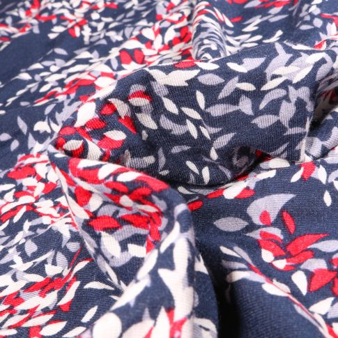 Tissu Jersey Viscose Lin Pétales de fleurs rouges blanches et grises sur fond Bleu marine