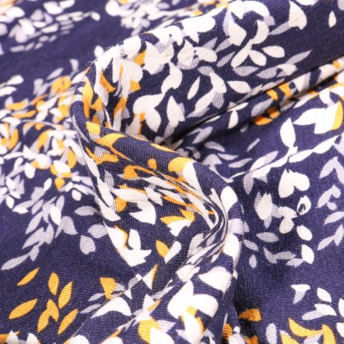 Tissu Jersey Viscose Lin Pétales de fleurs jaunes grises et blanches sur fond Bleu marine